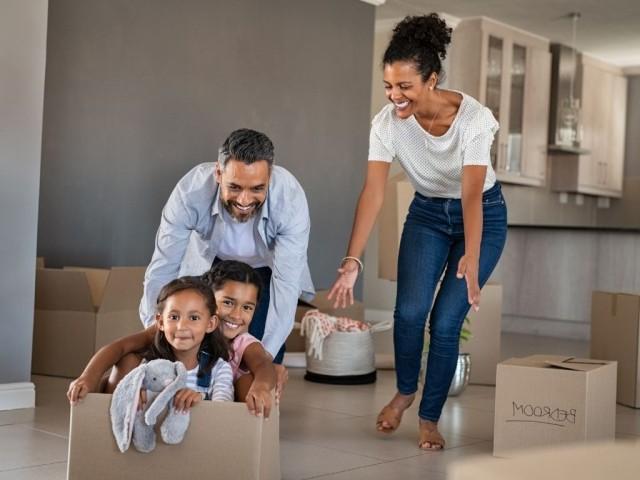 Family having fun in new house